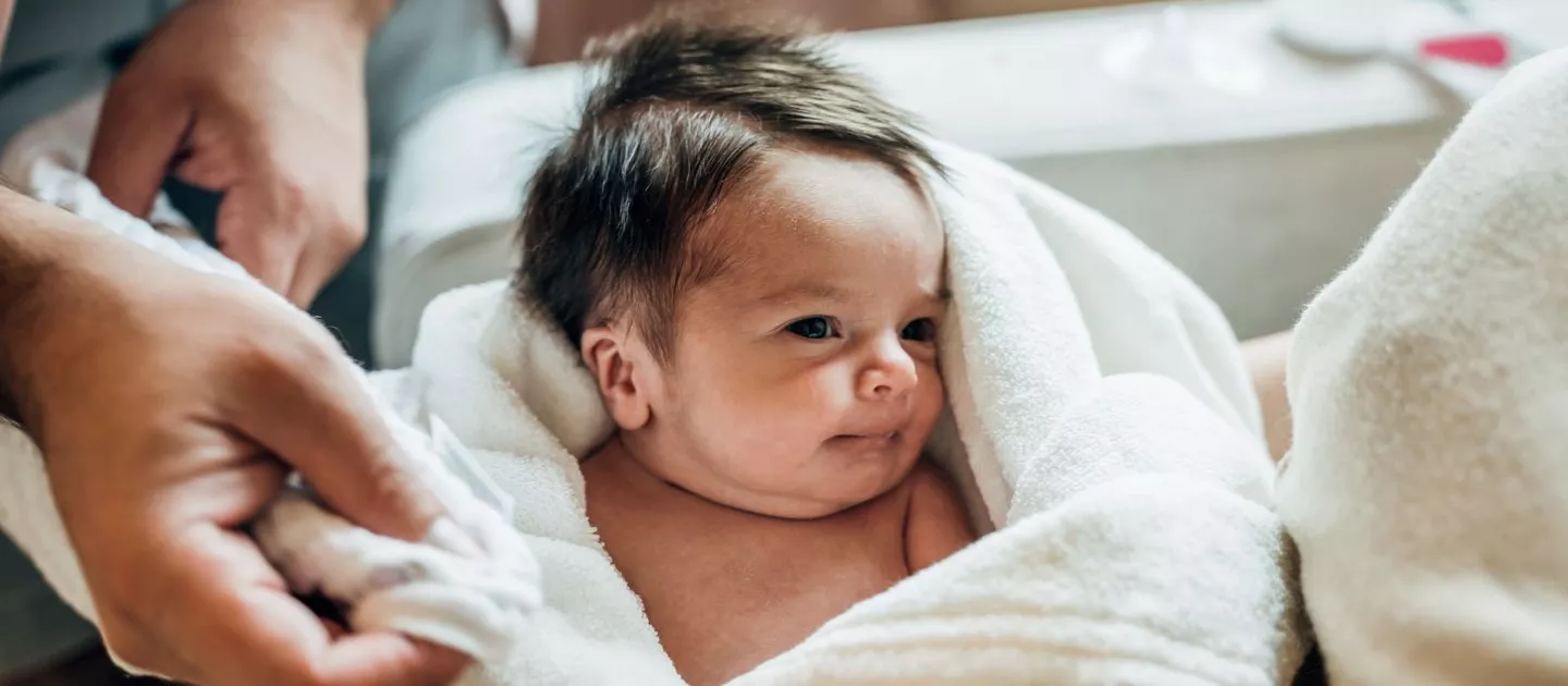 Adorable newborn baby wrapped in blanket